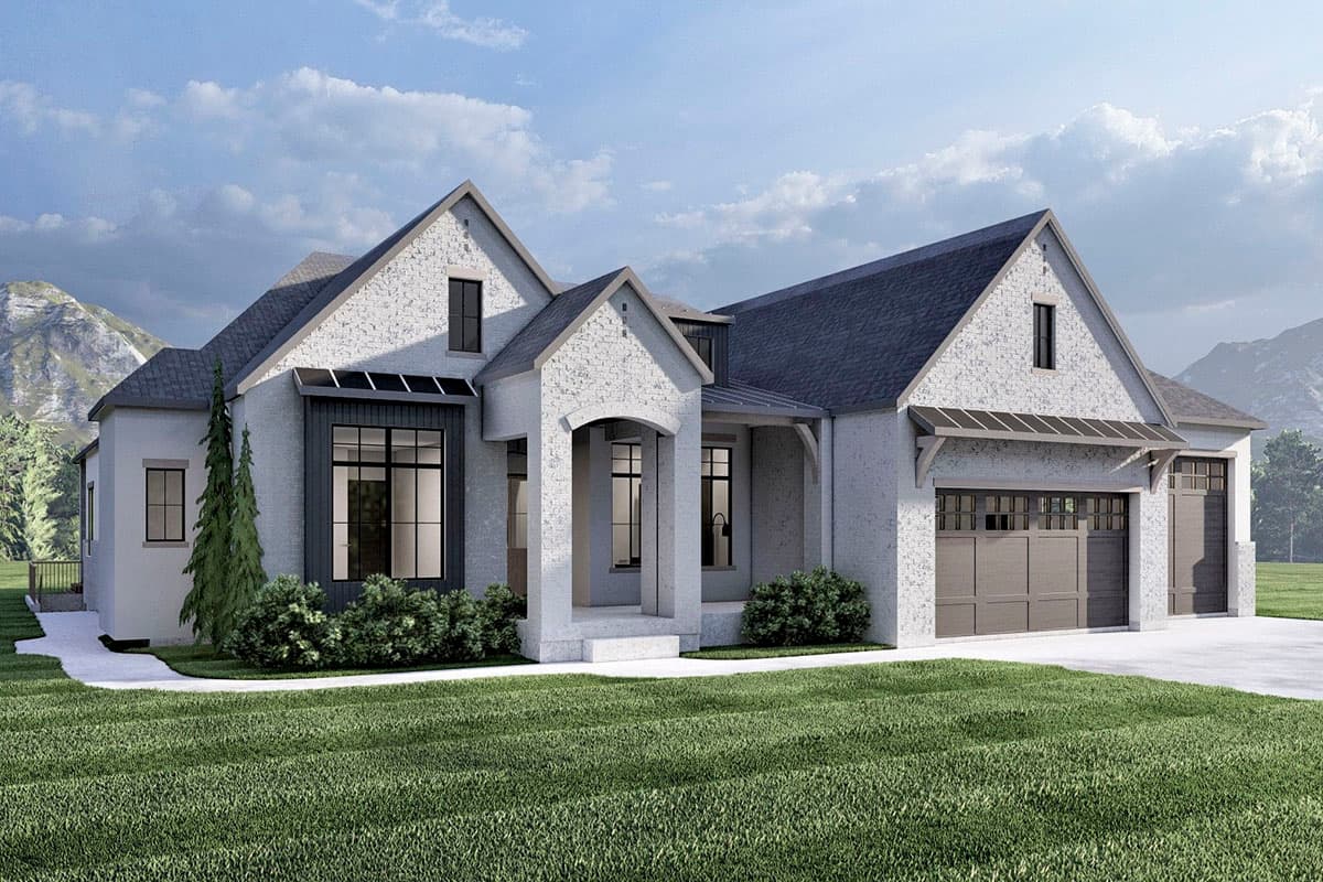 House plan exterior: Modern Farmhouse style, one story, featuring a prominent arched entryway, varied gables, and a three-car garage.