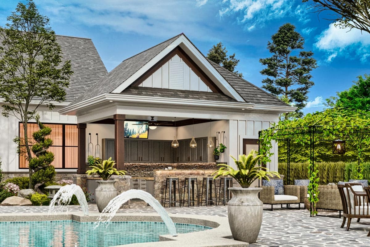 House plan exterior with a covered outdoor kitchen and bar, pool, and seating area.