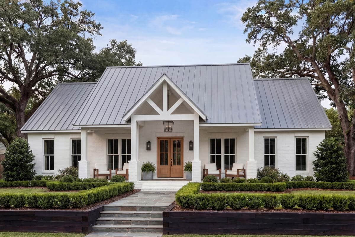 Modern Farmhouse house plan exterior with gable entry, metal roof, white brick walls, and double front doors.