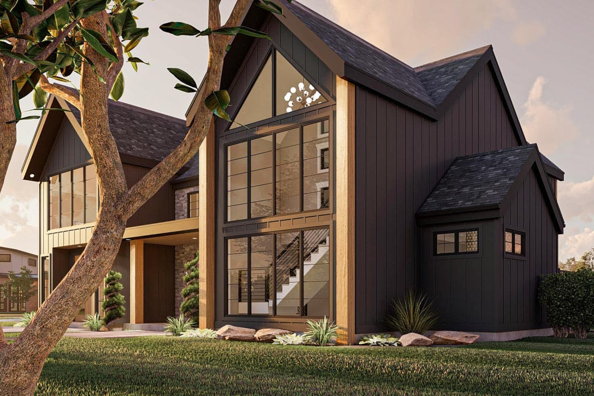 Modern house plan exterior with dark vertical siding, prominent gables, and a two-story glass facade showcasing stairs.
