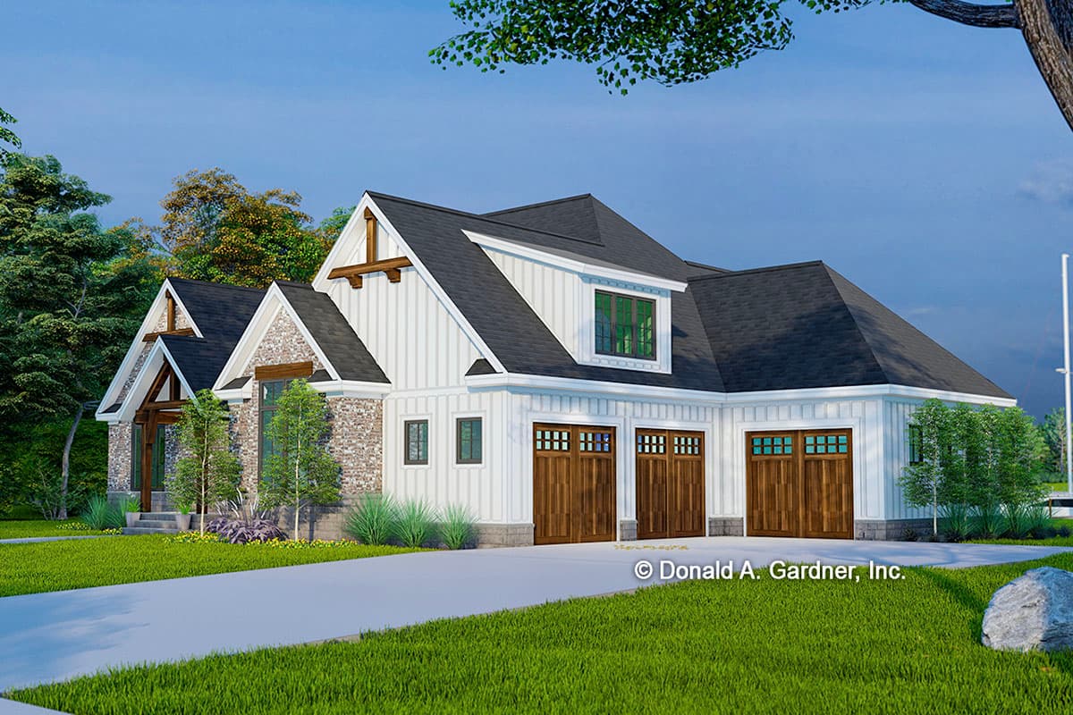 House plan exterior: Modern Farmhouse style, 1.5 stories, stone accents, timber gable brackets, and a three-car garage.