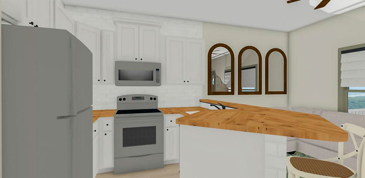 Kitchen with stainless steel refrigerator, range, microwave, white cabinets, wood countertops and arched mirrors.