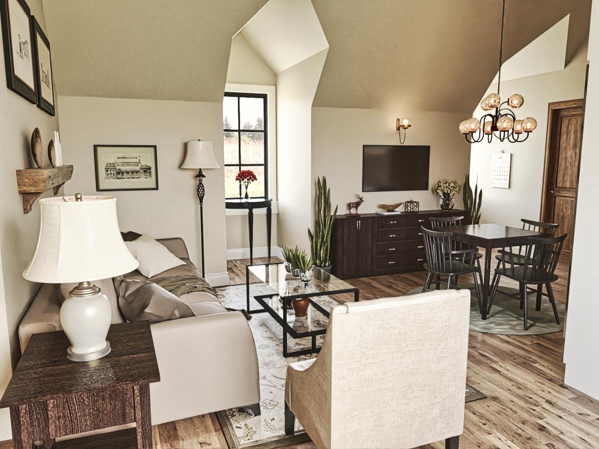 Living and dining area with vaulted ceiling, fireplace, TV, and dining table.