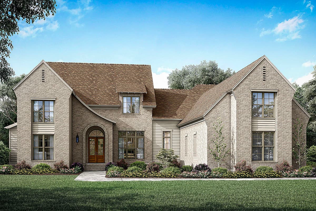 House plan exterior. Two-story brick home with gabled roof, arched entryway, and multiple dormers. Features include large windows and brick facade.