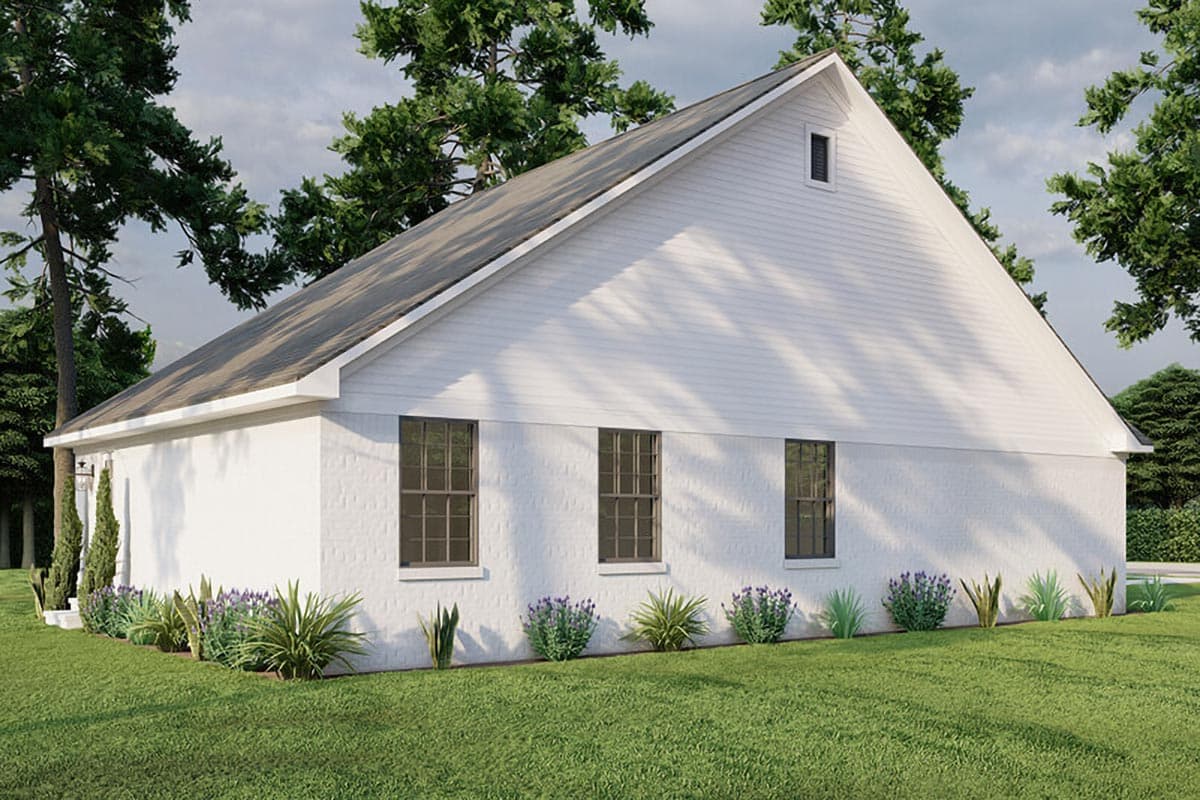 House plan exterior: one-story white brick building with gable roof, three windows on side, and a dormer window.