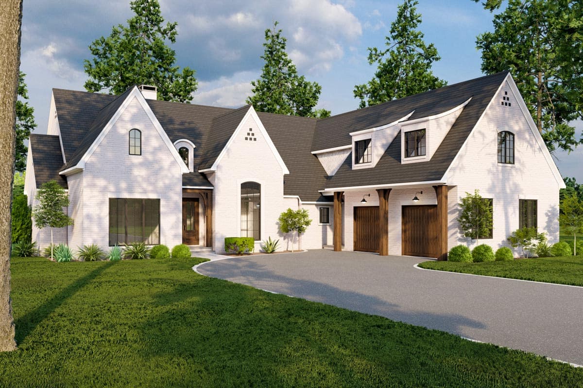 House plan exterior. Two-story Modern Farmhouse with gables, dormers, and a two-car garage. Features include arched windows and dark roof.