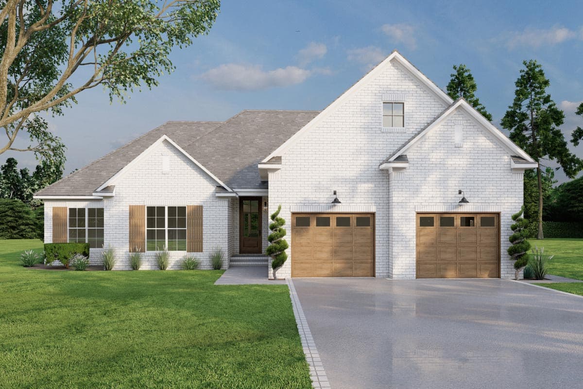 House plan exterior. Two-story, white brick, Modern Farmhouse style. Features include gabled rooflines, two-car garage, and shuttered windows.