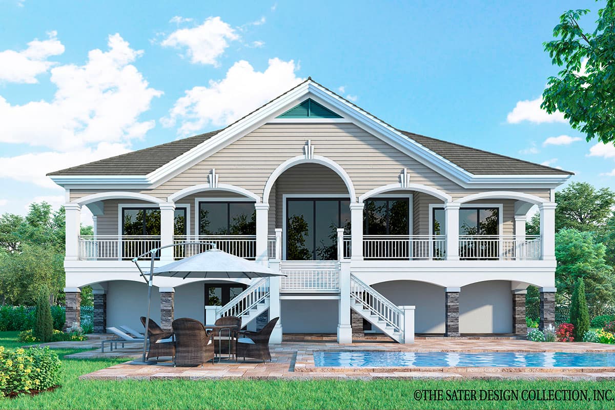 House plan exterior: Two-story coastal style with wraparound porch, arched windows on upper level, and pilings.
