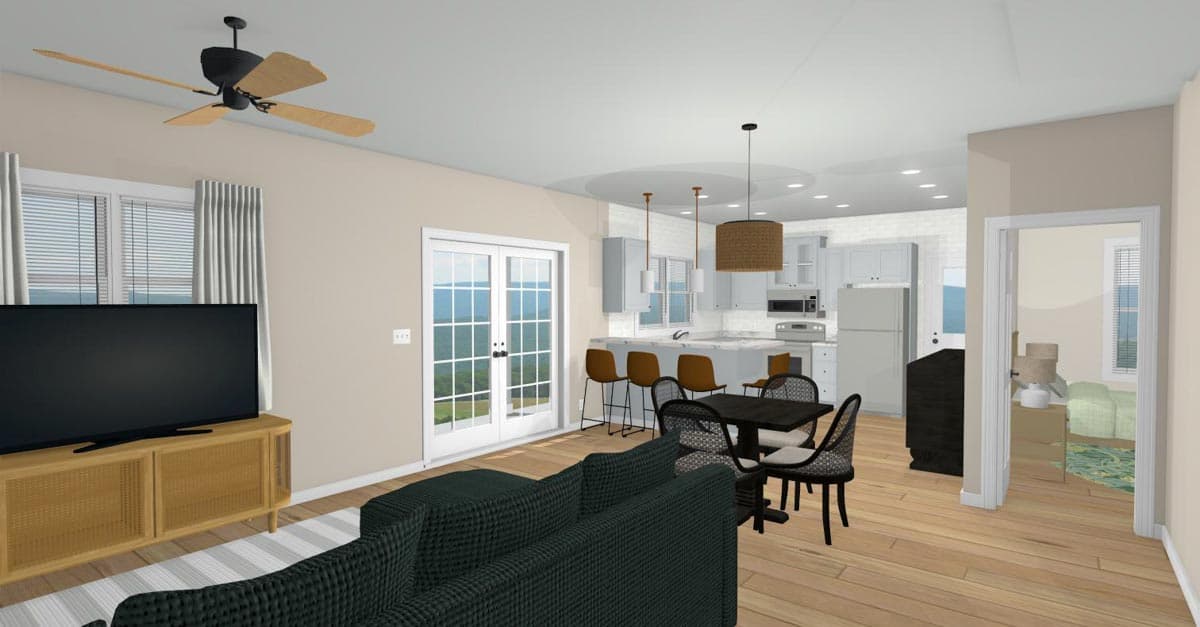 Open concept living area with kitchen island, dining set, sofa, and view through French doors.