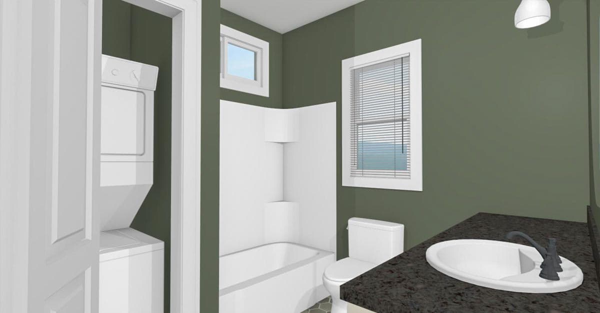 Bathroom floor plan with stacked washer/dryer, corner tub, toilet, and vanity with sink.