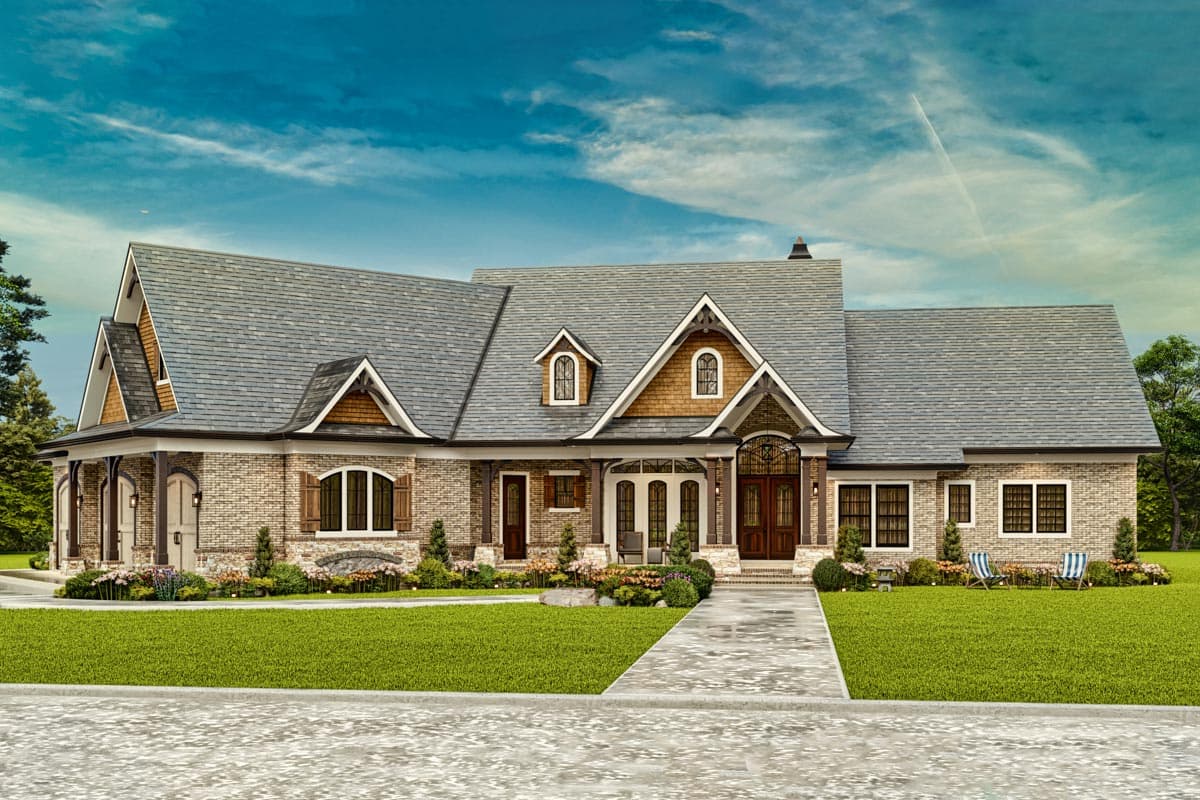 House plan exterior of a one-story brick home with a prominent gable, dormers, arched entryway, and covered porch.