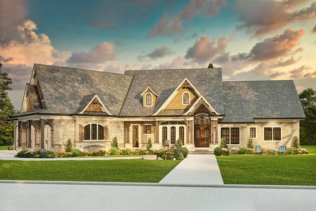 House plan exterior featuring a symmetrical facade, brickwork, multiple gables, dormers, and a covered entry with double doors.