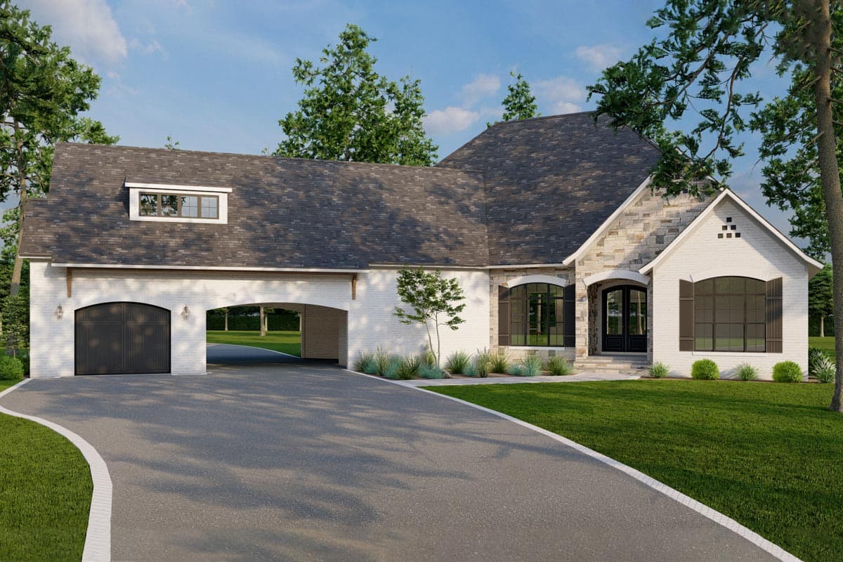 House plan exterior. One-story home with stone and white brick facade. Features include a porte-cochere, gable, and arched garage door.