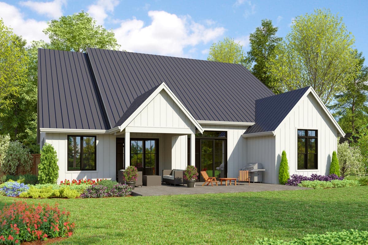 Modern Farmhouse house plan exterior with a metal gable roof, white board and batten siding, and covered patio.