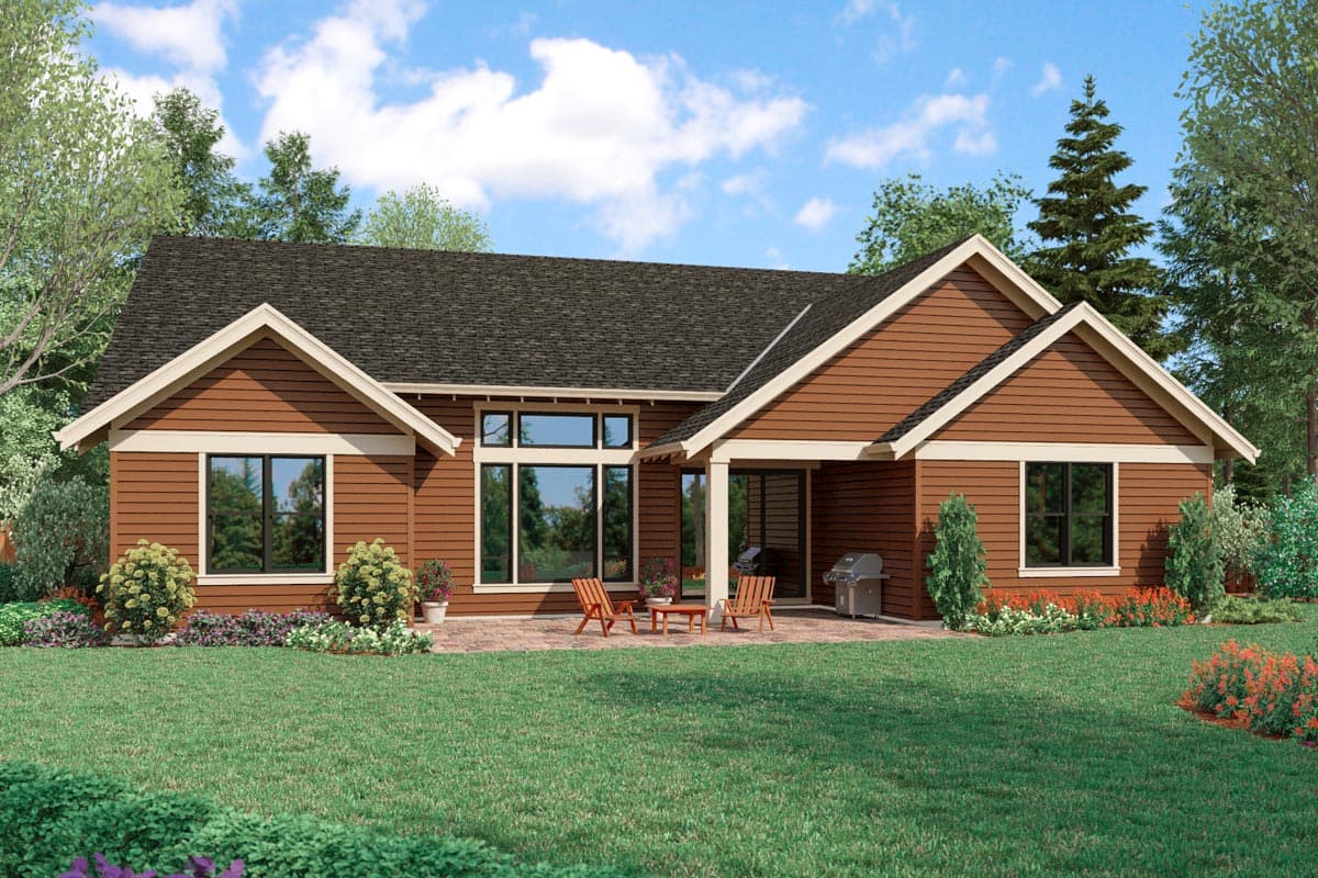 Ranch style house plan exterior with brown siding, multiple gables, and a covered patio with seating.