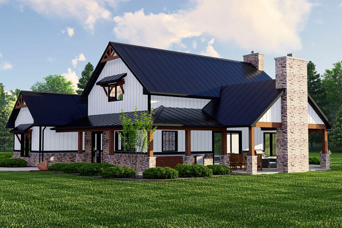 Modern farmhouse house plan exterior with white board-and-batten siding, stone base, black metal roof, and prominent stone chimney.