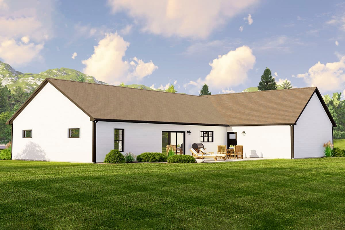 House plan exterior: Ranch style, single story, L-shaped, white siding, dark trim, gable roof, patio with furniture.