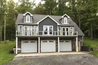 Traditional 2-Bed Carriage House Plan with Island Kitchen and Sun Deck