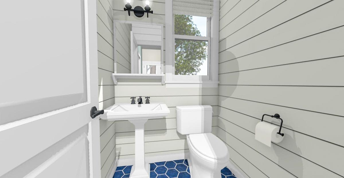 Bathroom interior with pedestal sink, toilet, shiplap walls, hexagonal blue floor tiles, and a window.