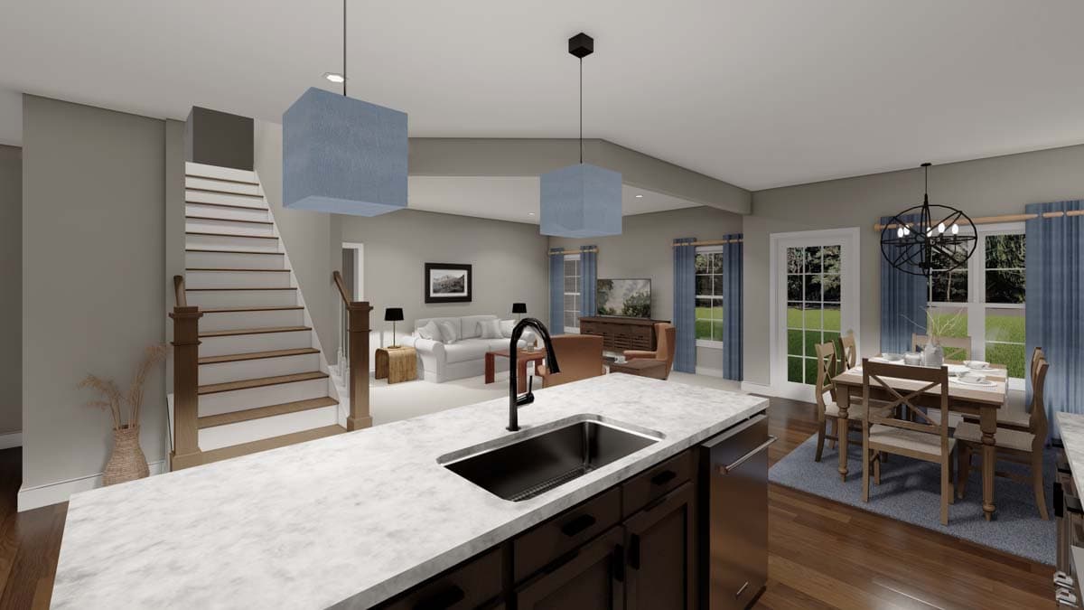Interior view of a house plan showing an open layout with a kitchen island, living room, and dining area.