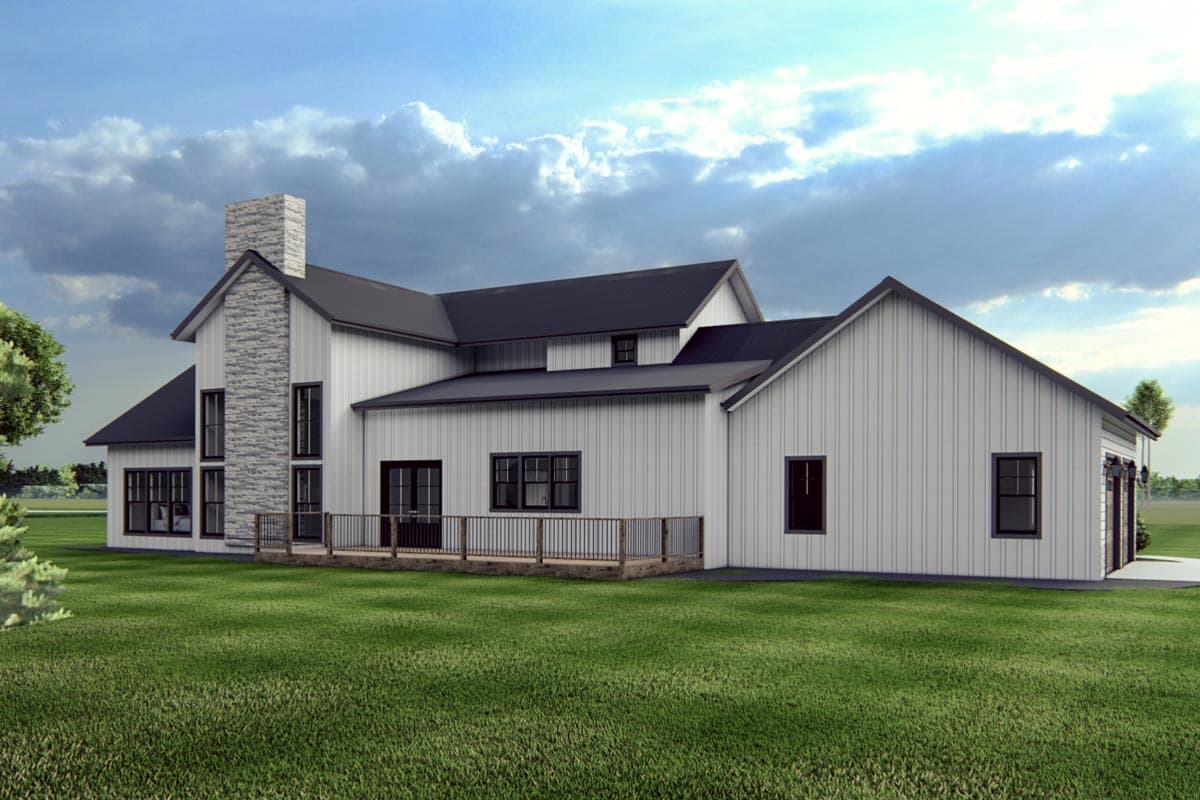 Modern Farmhouse house plan exterior with white vertical siding, stone chimney, dark roof, deck, and side-entry garage.