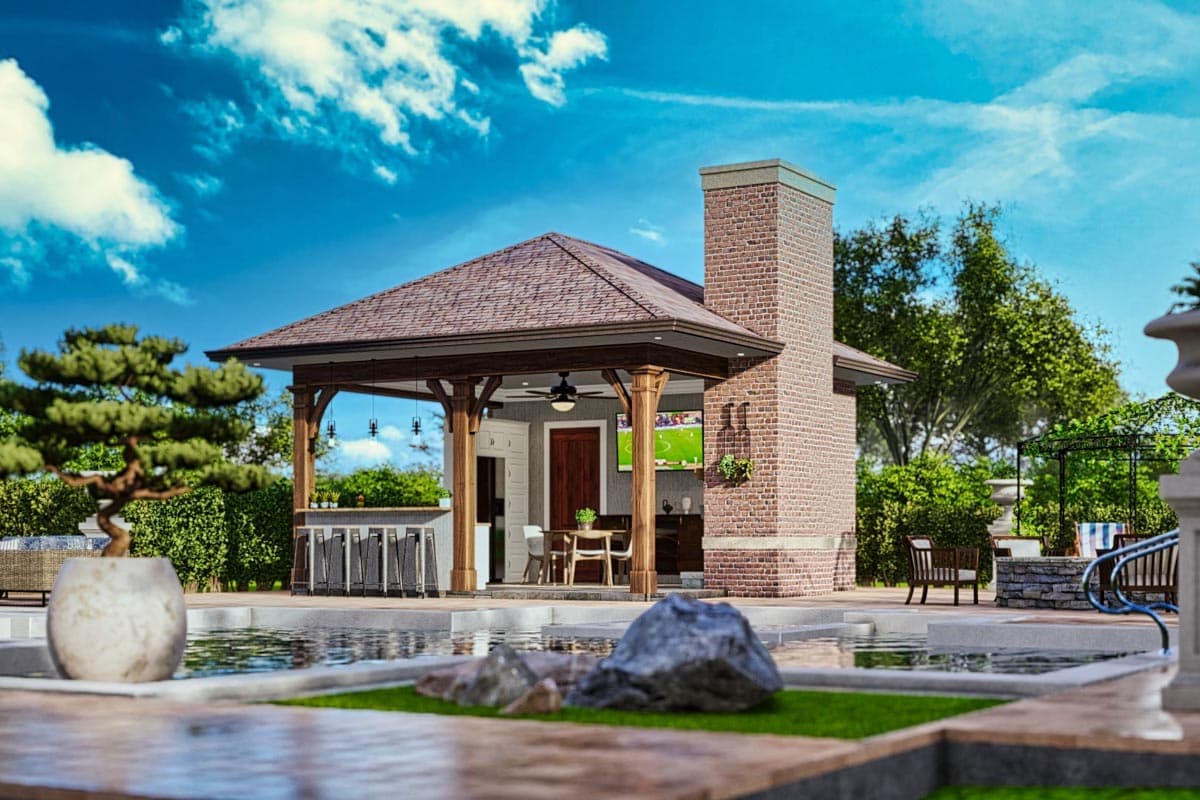 Outdoor pavilion with bar, dining area, and brick fireplace adjacent to a swimming pool.
