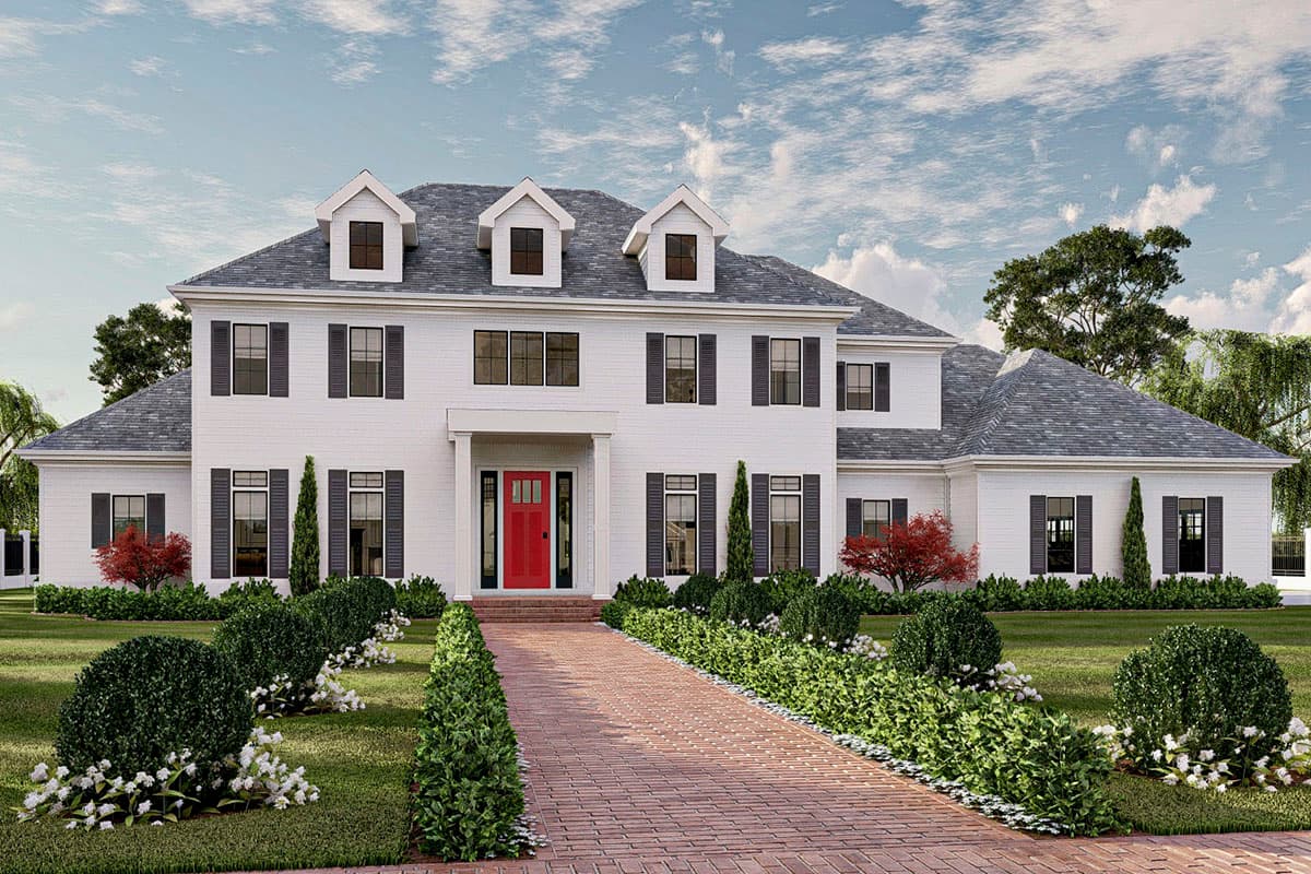 House plan exterior. Two-story Colonial with dormers, shutters, and a front-facing gable. Features include a brick paver driveway and a covered entry.