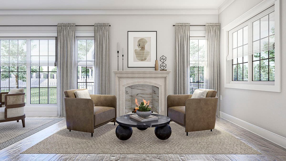 Interior view of a living room with a stone fireplace, two armchairs, a coffee table, and large grid-pattern windows.