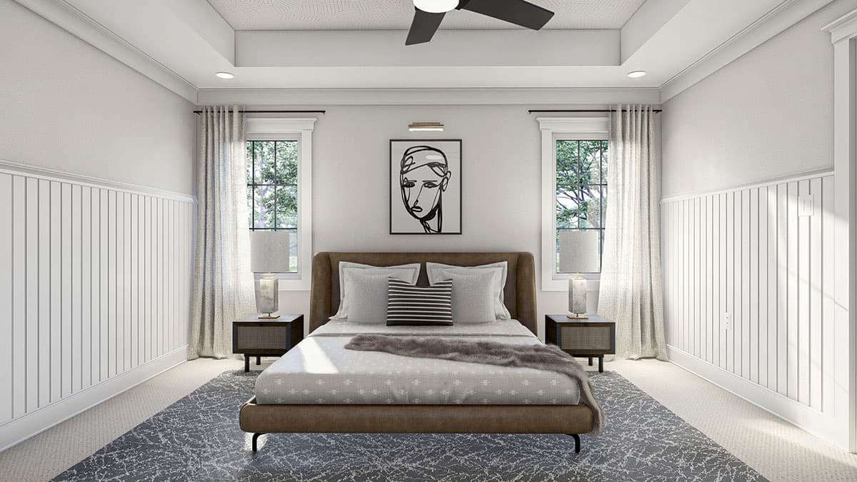 Bedroom interior with a queen bed, paneled walls, coffered ceiling with fan, and two windows with curtains.