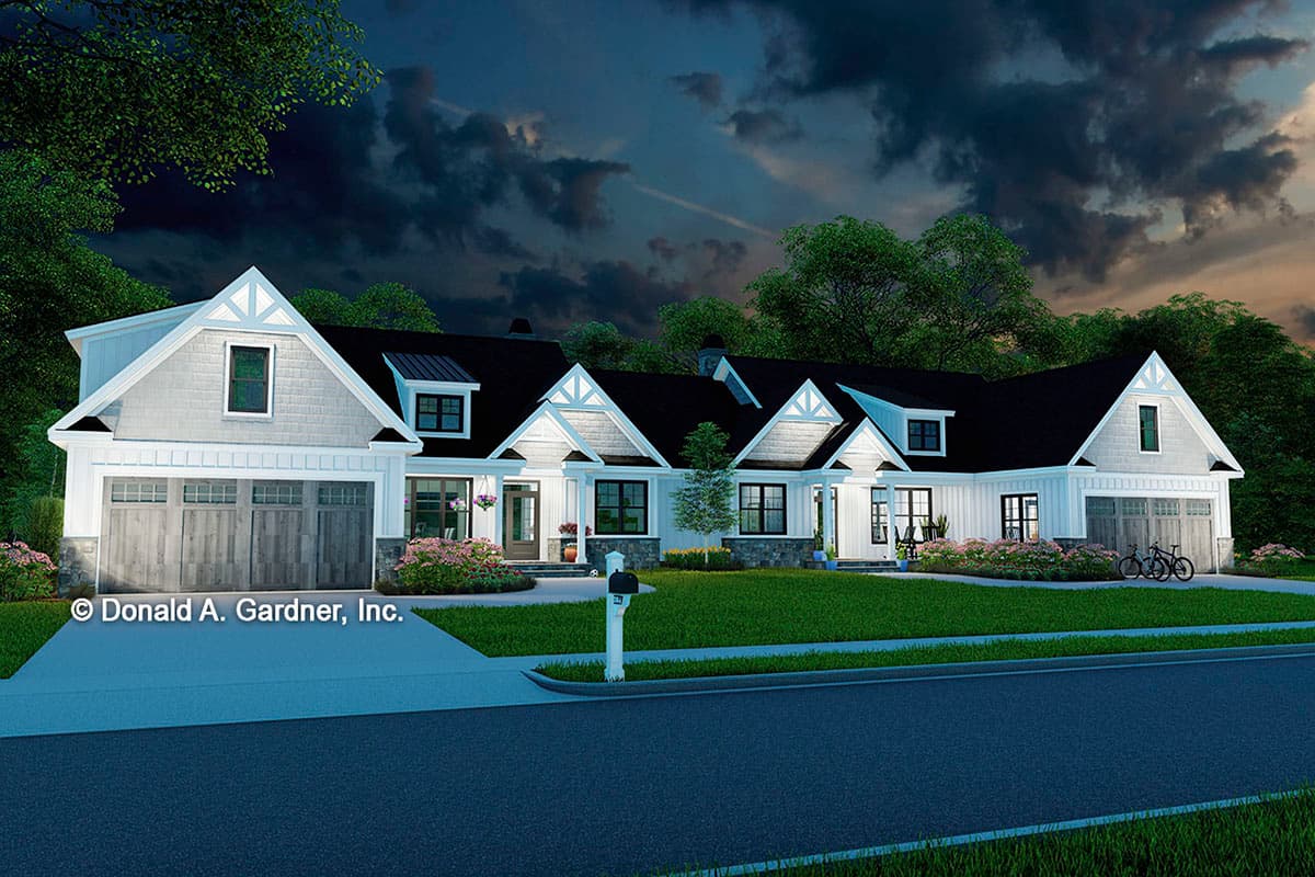 House plan exterior of a Modern Farmhouse style home, featuring gables, dormers, a covered porch, and a side-entry garage.