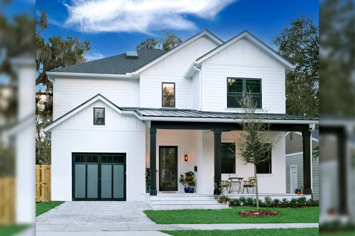 House plan exterior featuring a two-story Modern Farmhouse design with a porch, gables, and a dark-trimmed garage door.