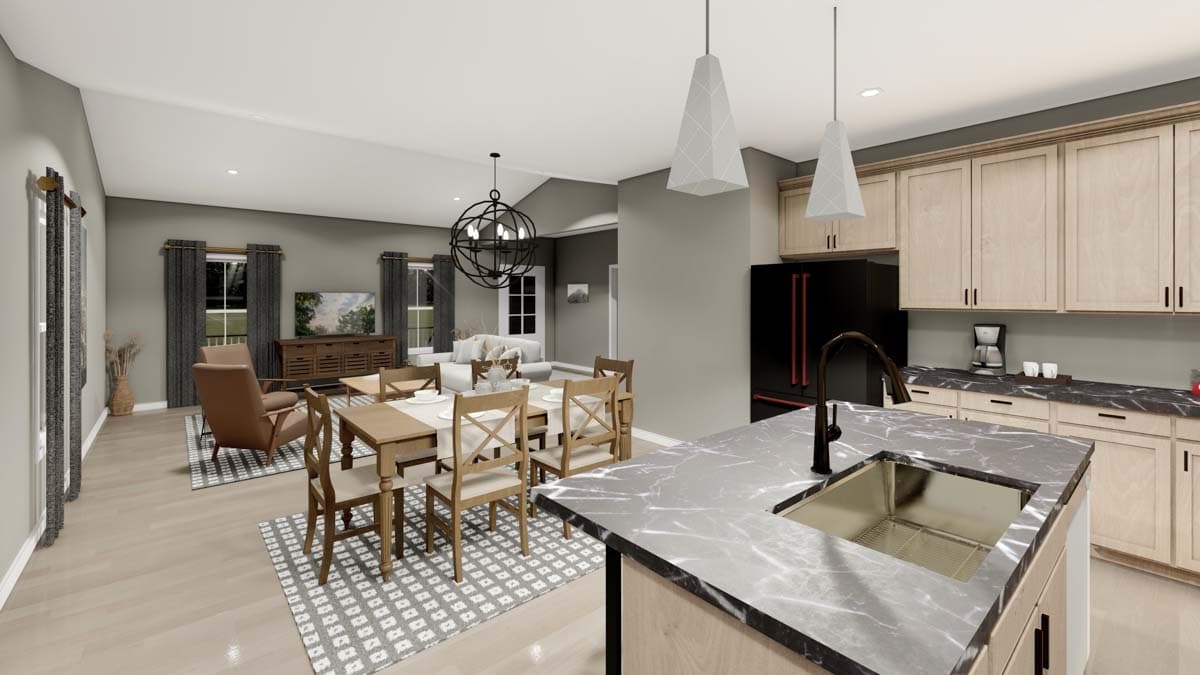 Open-concept living and dining areas adjacent to a kitchen with a large island, light wood cabinets, and stainless steel sink.