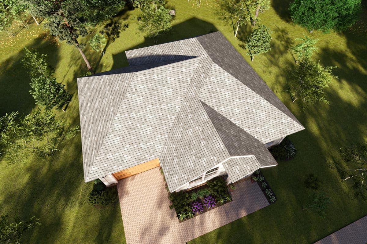 House plan exterior aerial view, showing complex rooflines, attached garage, and entryway landscaping.