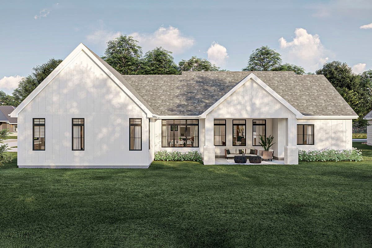 Modern Farmhouse house plan exterior, one story, with board and batten siding, gables, and covered patio with outdoor seating.