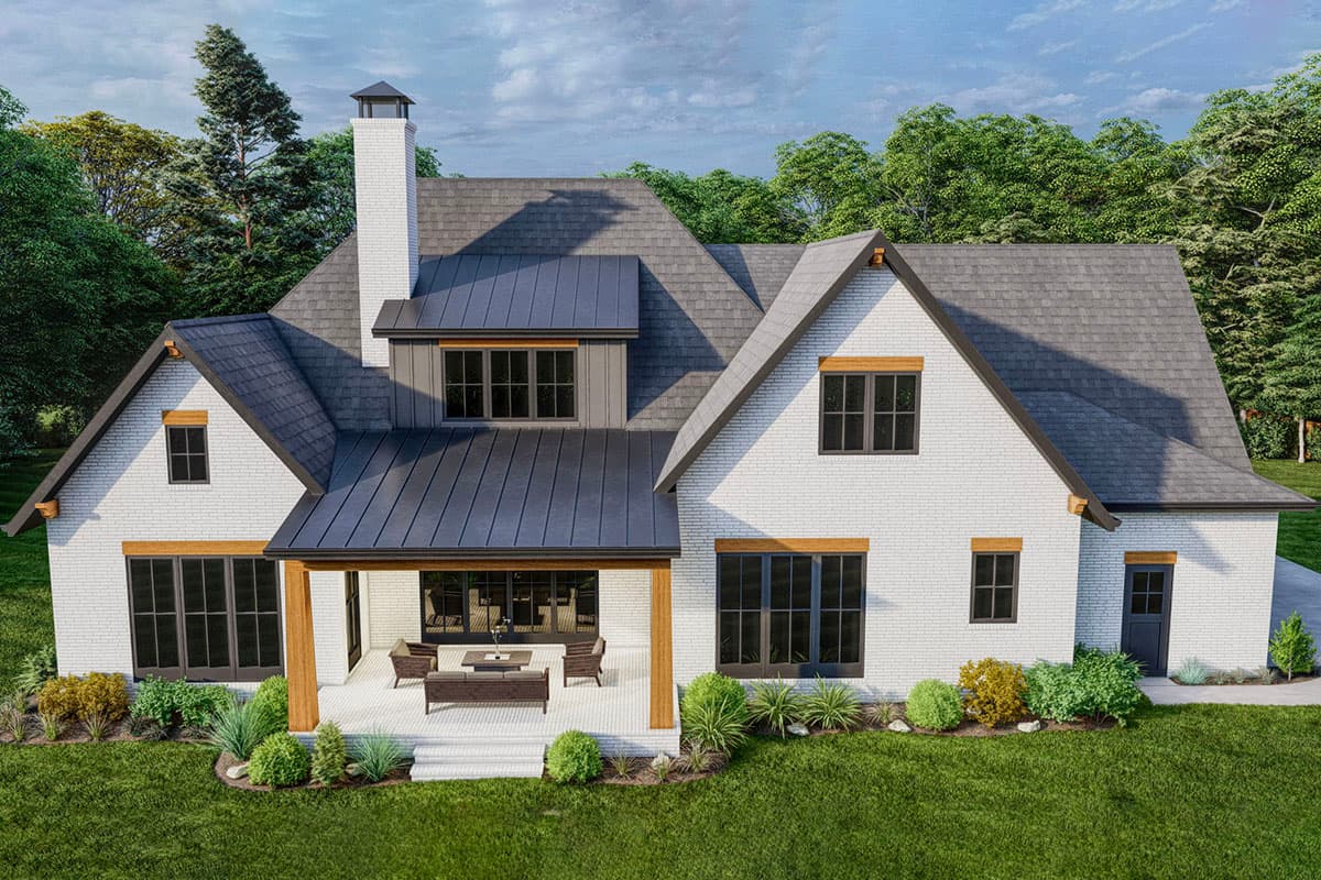 House plan exterior: Modern Farmhouse style, white brick, dark metal roof, prominent chimney, gabled dormer, covered porch with seating.