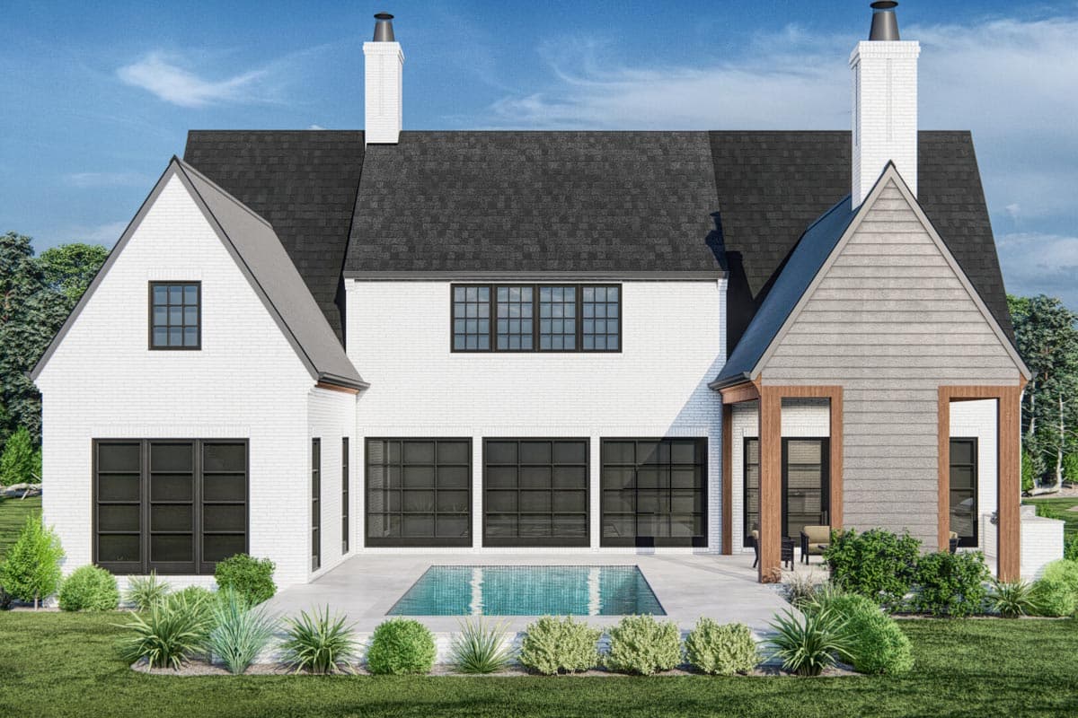 House plan exterior with white brick, multiple gables, large black windows, and a pool.