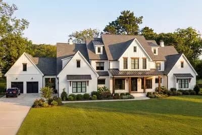 Exclusive Modern Farmhouse Plan with Large Vaulted Porch and Porte-Cochere