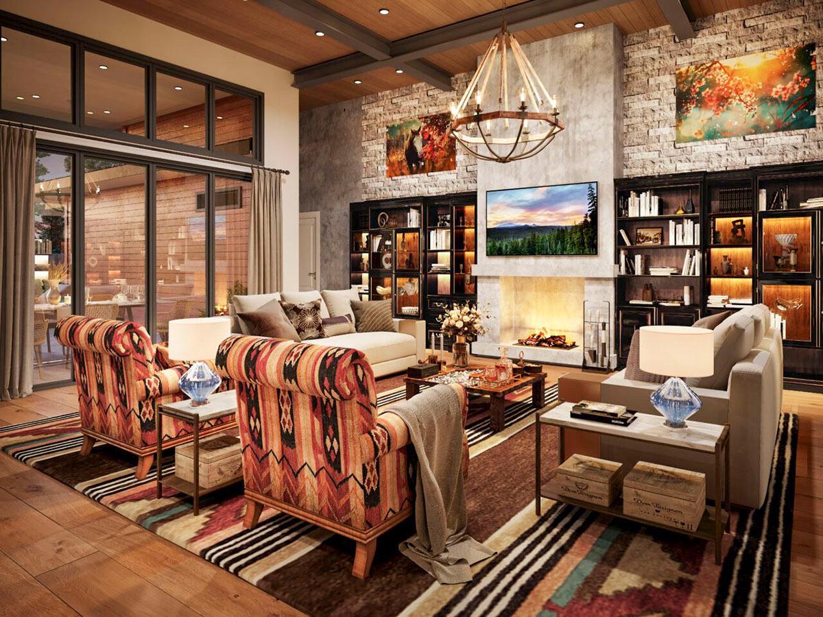 Great room with stone fireplace, built-in bookshelves, large windows, and wood plank ceiling.