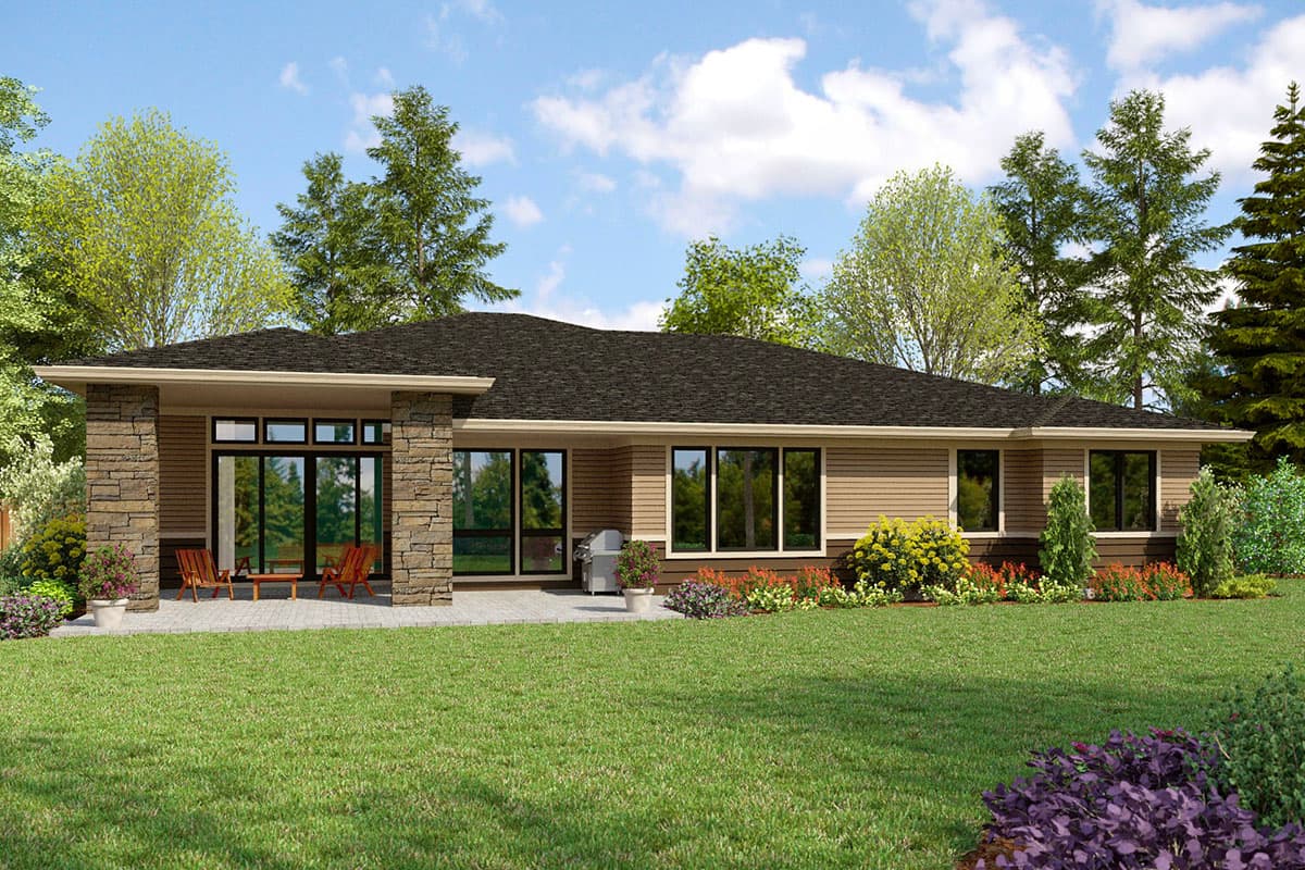 House plan exterior: Single-story home with stone accents, large windows, and covered patio.