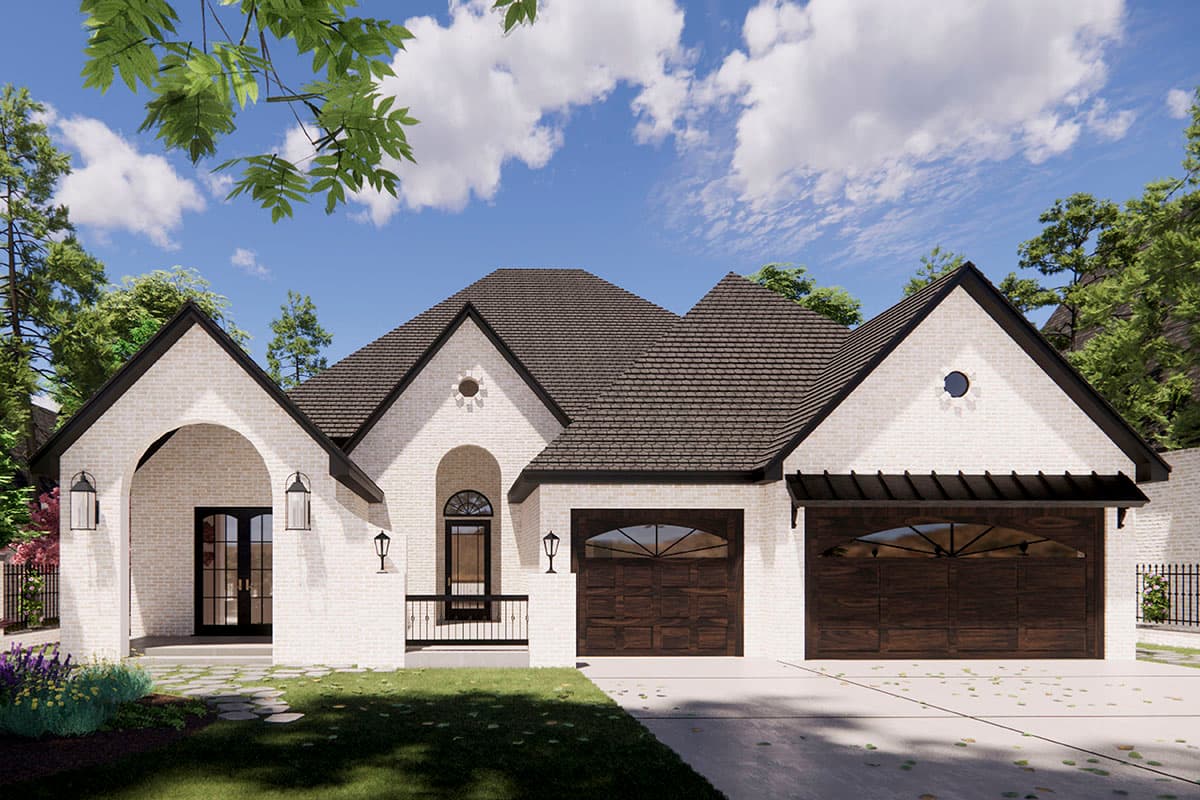 House plan exterior with brick facade, multiple gables, arched entry, and dark wood garage doors. Includes small round windows in gables.
