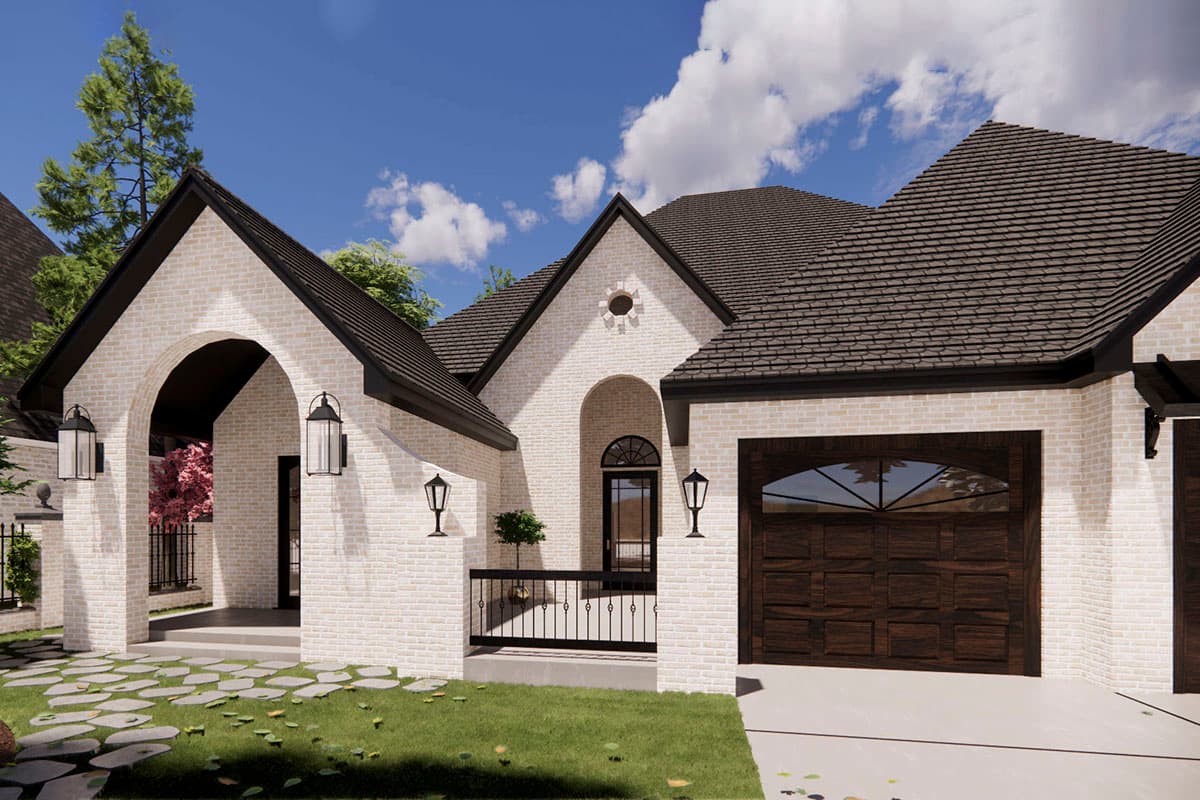 House plan exterior: White brick, hip roof, arched entry, gabled dormer with circular window, attached garage.