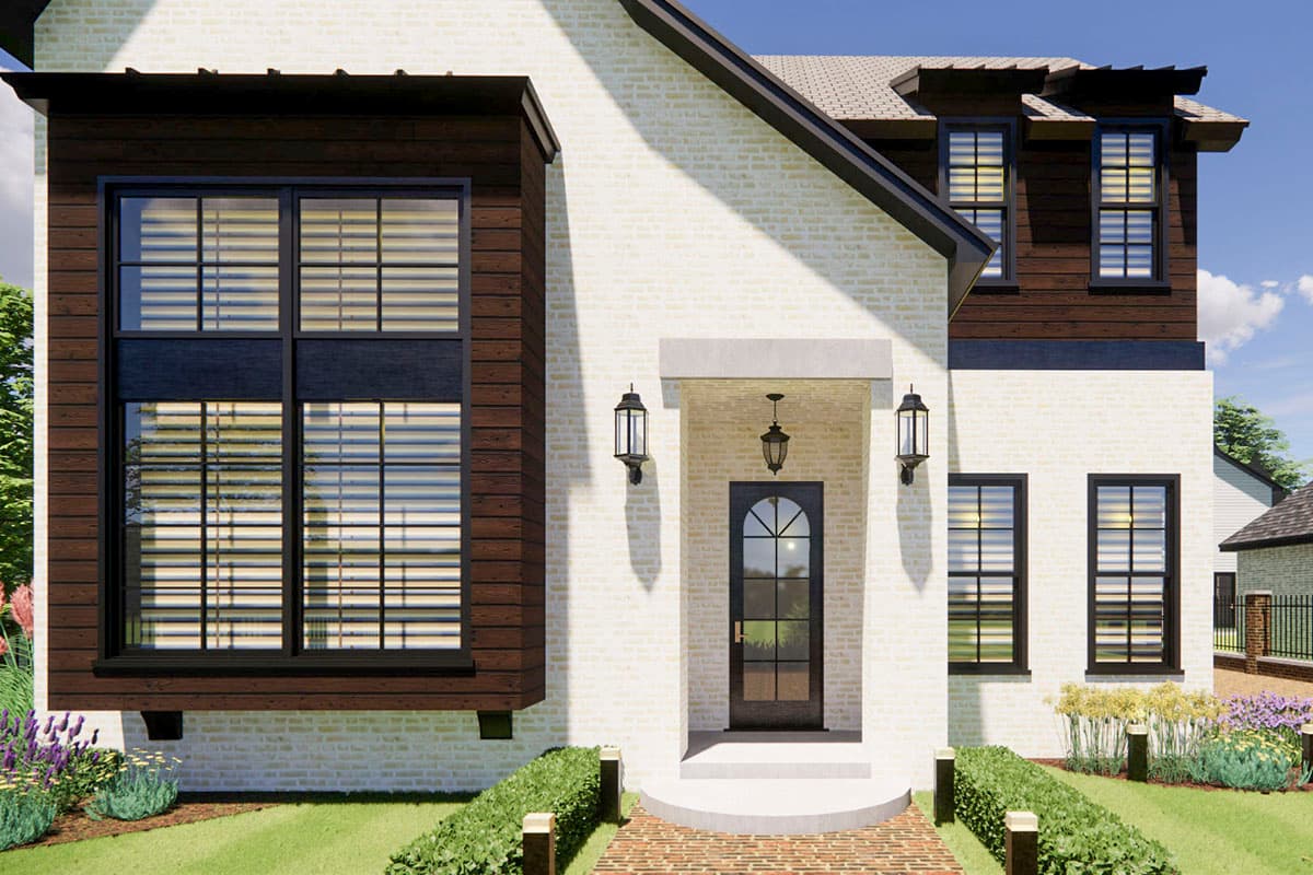 House plan exterior: Two-story, white brick facade with dark wood siding accents, prominent gable with dormers, and arched glass entry door.
