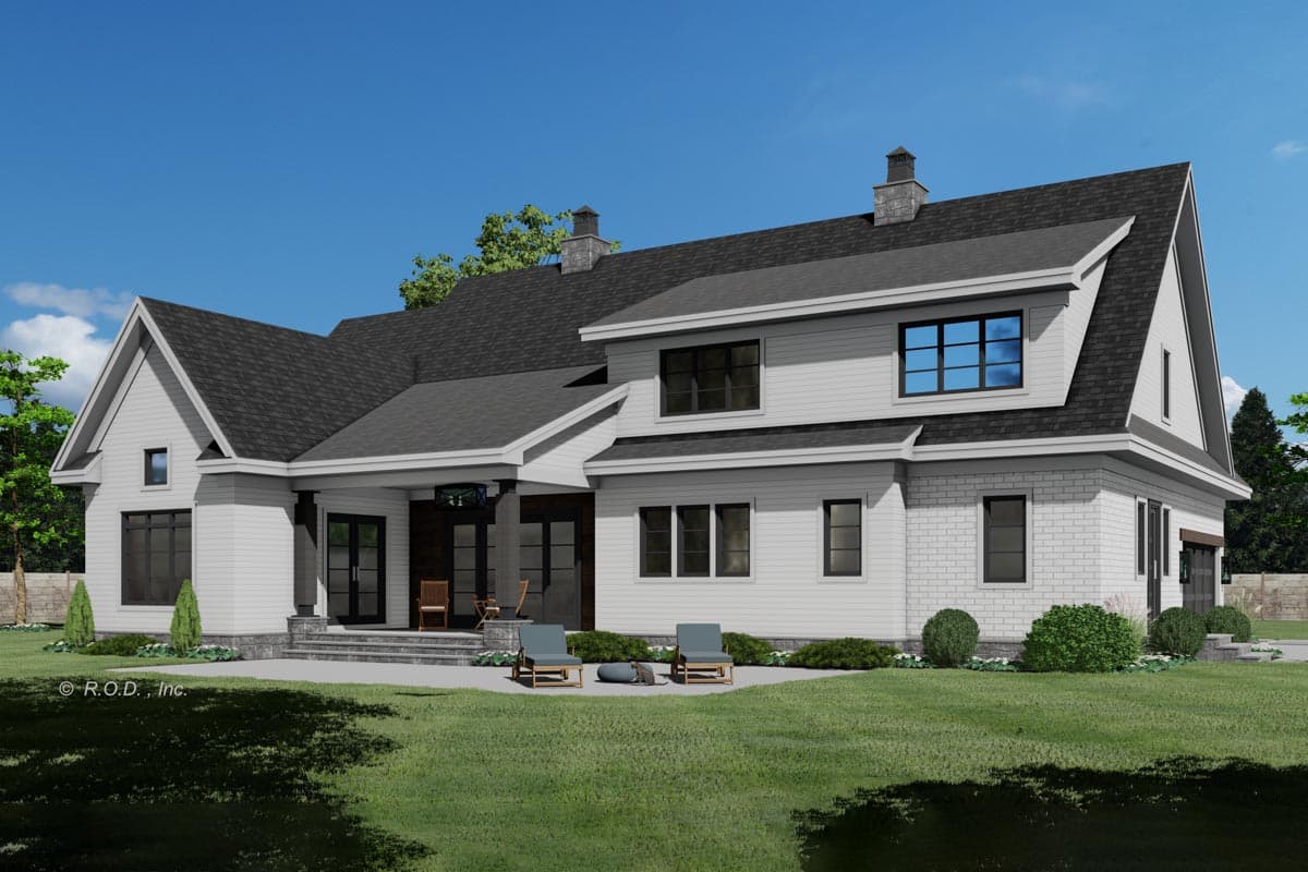 Modern house plan exterior with white siding, brick accents, two-story gables, covered porch, and prominent chimneys.