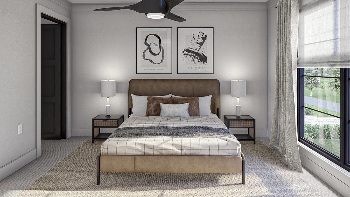 Primary bedroom with upholstered headboard, bedside tables, contemporary art, and a ceiling fan.