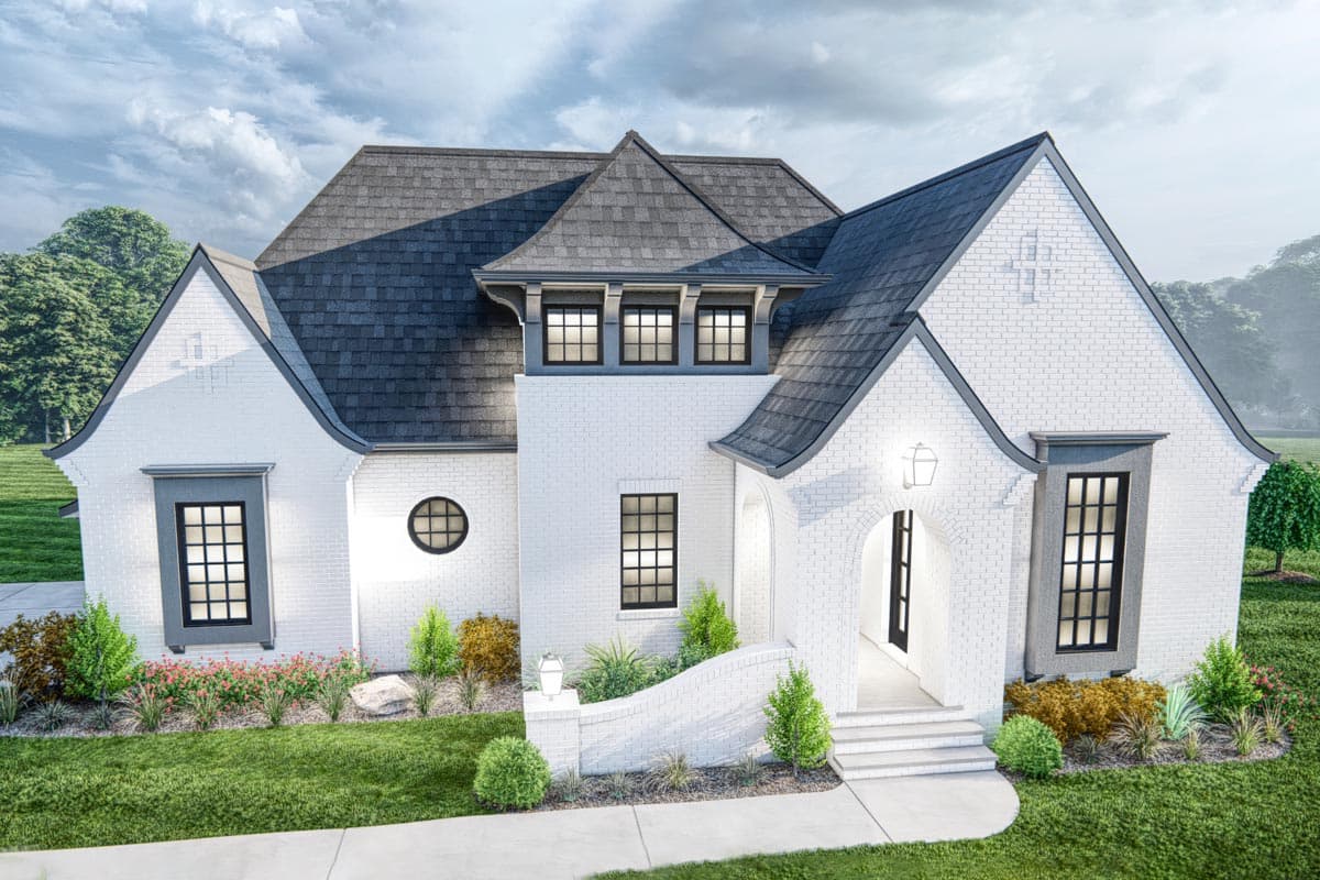 House plan exterior: White brick home with dark roof, arched entry, multiple gables, dormer windows, and decorative brickwork.