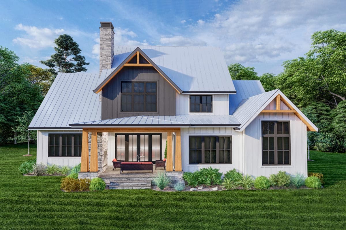 House plan exterior: Modern Farmhouse style, two stories, metal roof, stone chimney, gabled dormer, and covered porch.