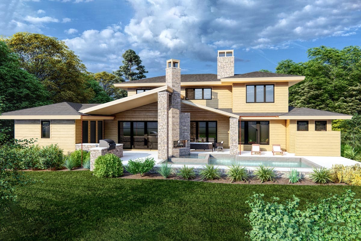 Modern house plan exterior with multiple gables, stone chimney, outdoor grill, pool, and patio.