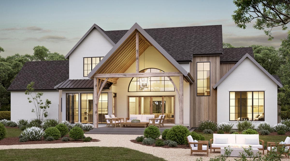 Modern Farmhouse exterior with gables, wood accents, large windows, and covered outdoor living space.
