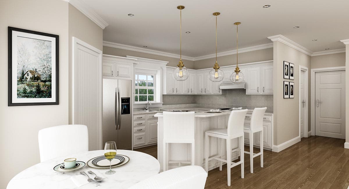 Open concept kitchen with white cabinets, island with seating, stainless steel refrigerator, and pendant lighting.