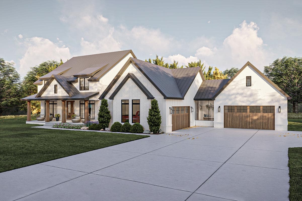 House plan exterior: Modern Farmhouse style, two-story with wide covered porch, gables, and a three-car garage.